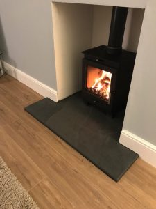 T Shaped hearth for log burning stove with regulation front depth