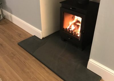 T Shaped hearth for log burning stove with regulation front depth