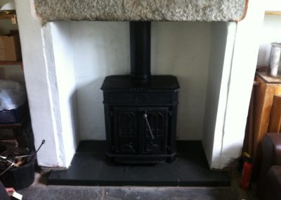 Multi-piece hearth for reconditioned stove